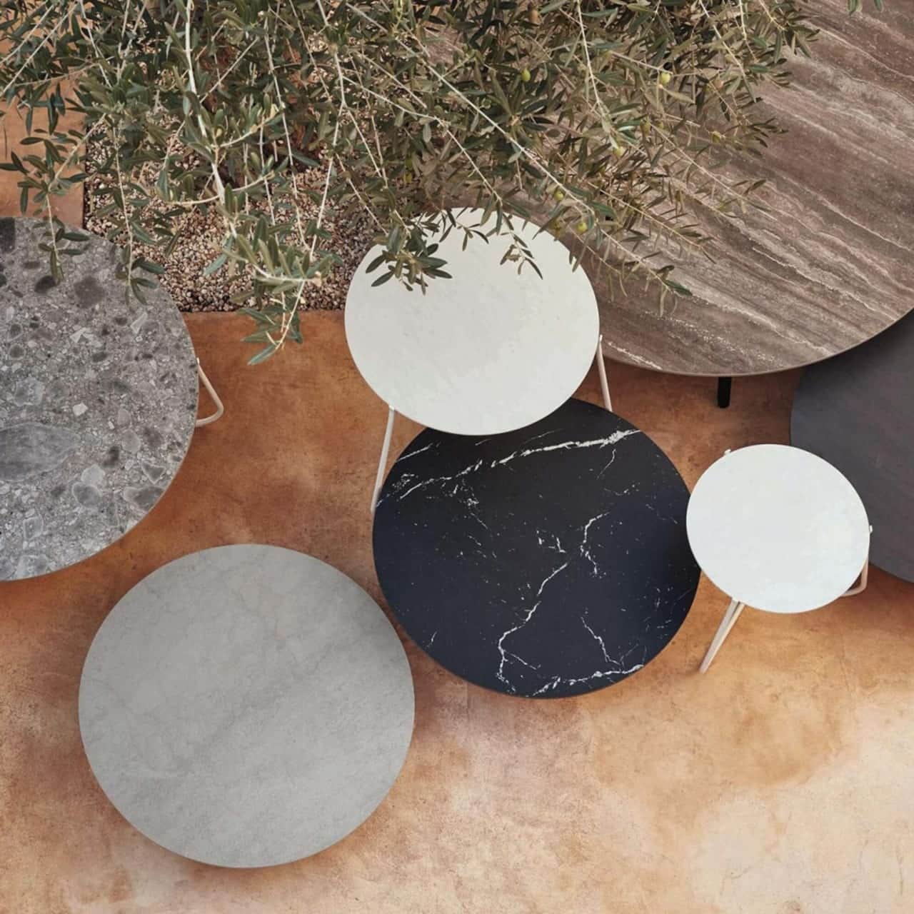 nesting tables: mix and match mood low tables to make a bold statement with different materials