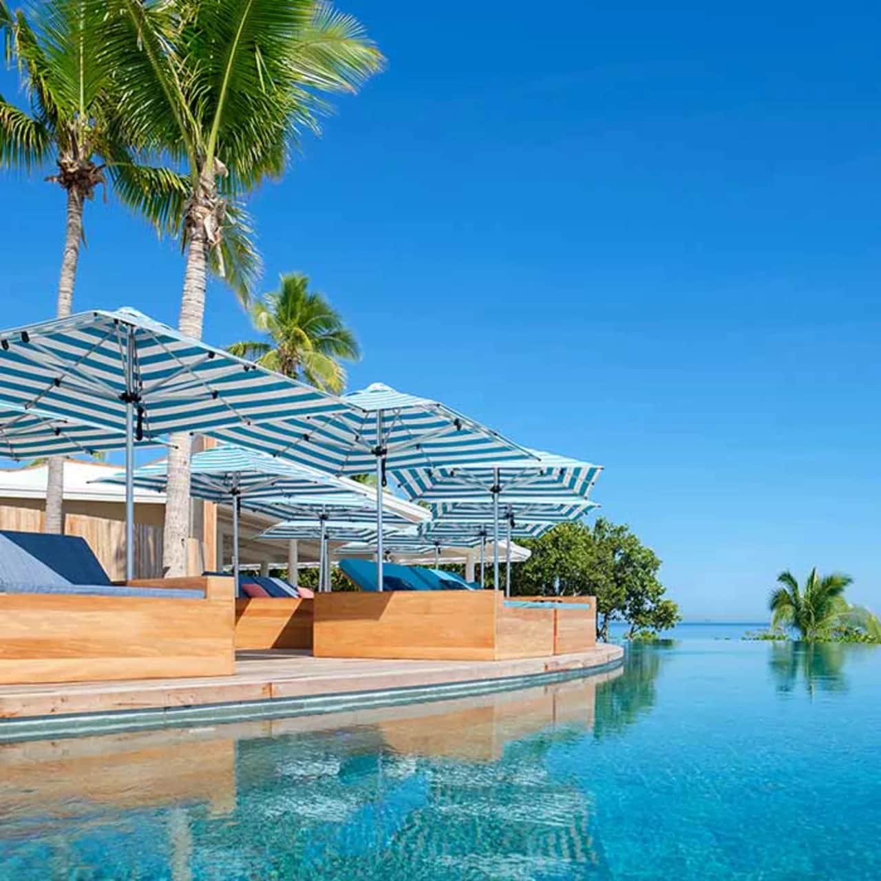 perfect shade while on vacation: 10' square monterey center post giant patio umbrella in blue stripe
