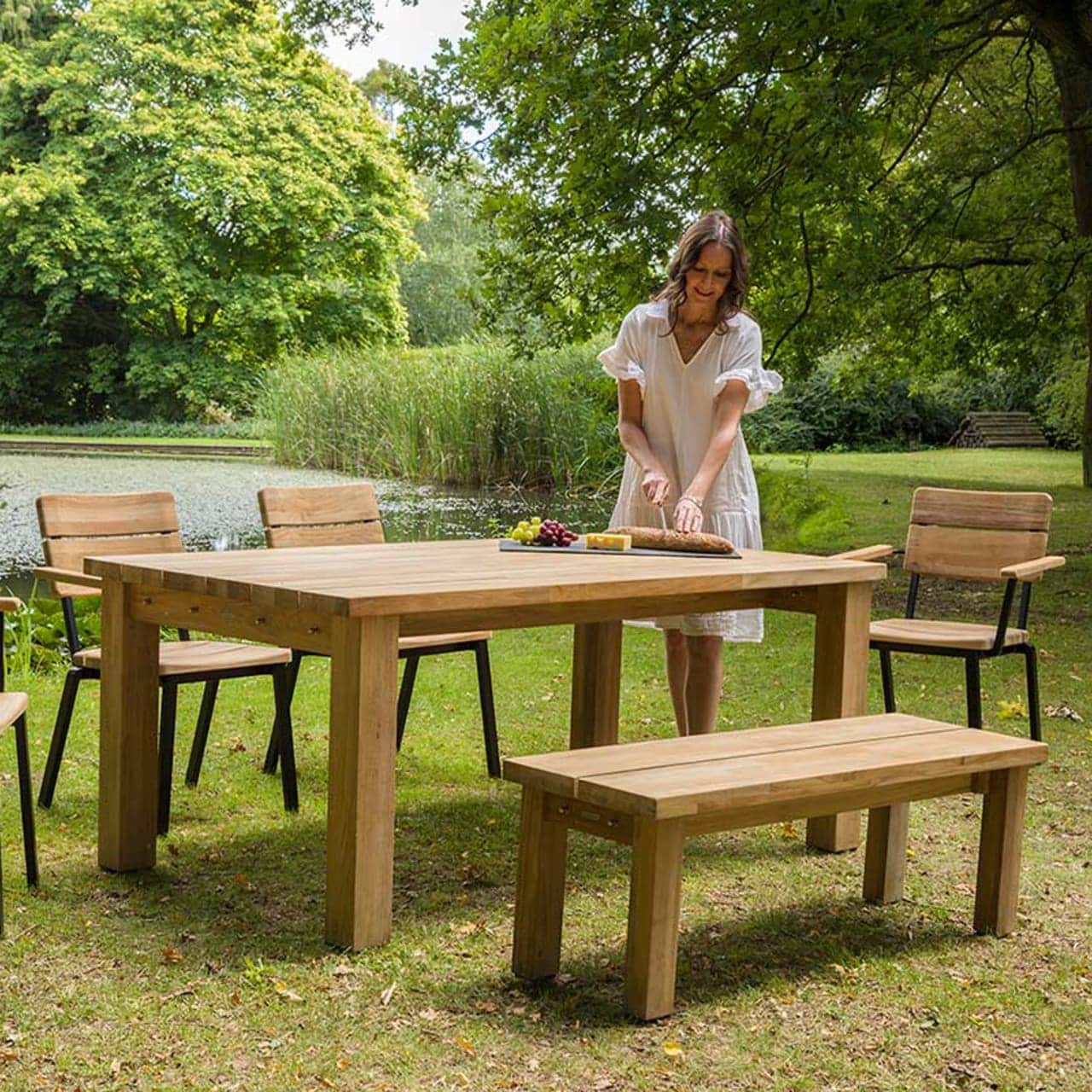 Barlow Tyrie Titan Stacking Rustic Teak Armchairs and 51" Dining Bench with 71" Dining Table