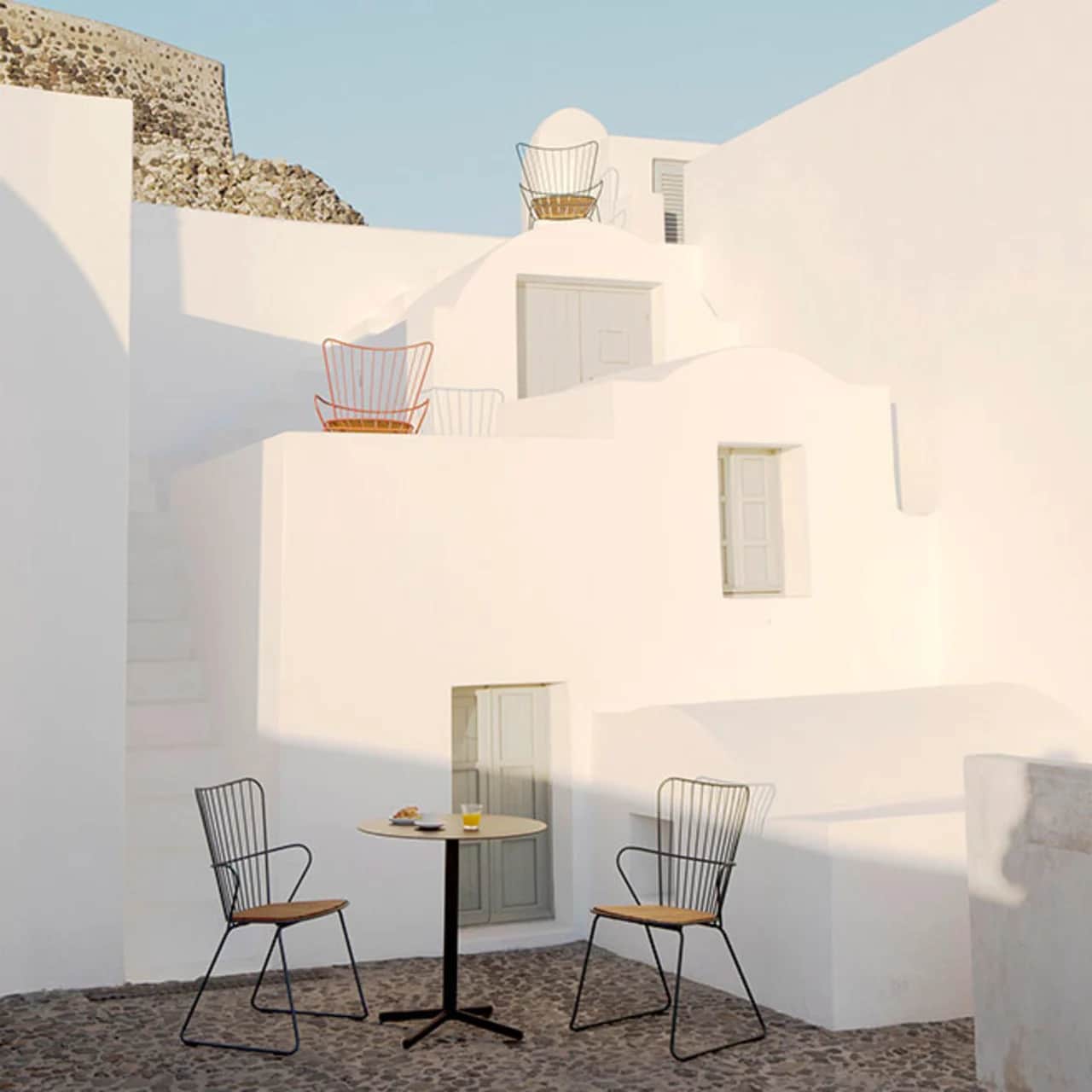 mediterranean flair: paon dining chairs with flor round cafe table